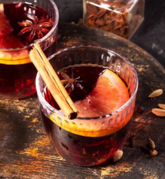 Non Alcoholic Mulled fruit drink with wine glasses